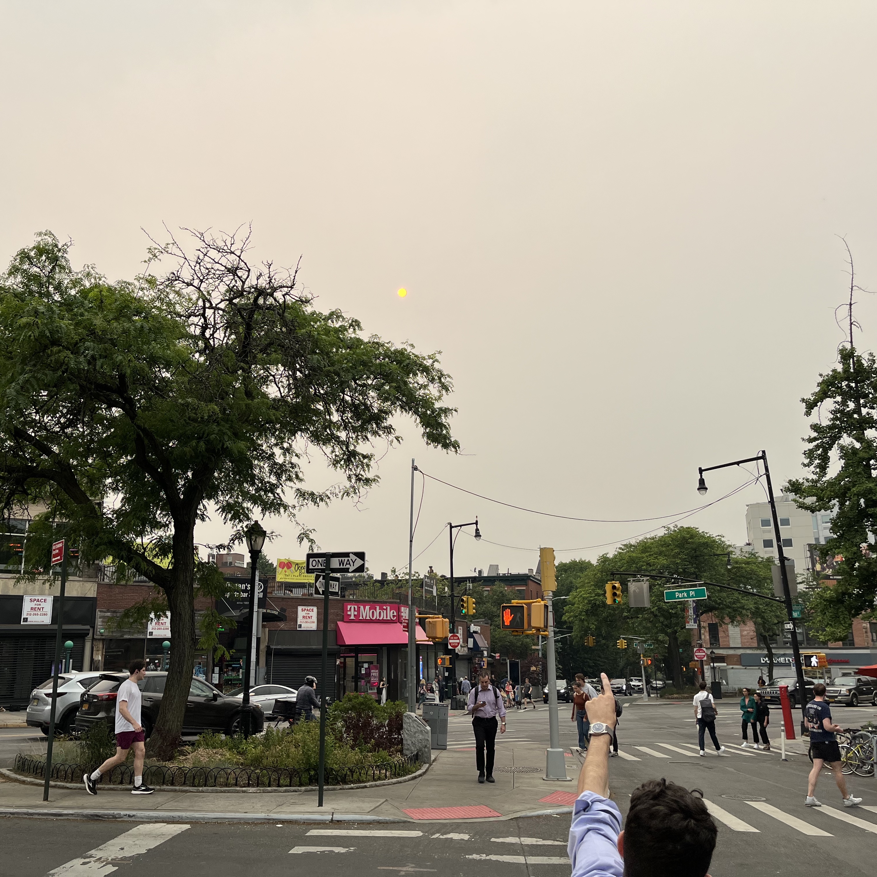 Don't look up! The sun obscured by Canadian wildfire smoke as seen from Flatbush and 7th Avenues in Brooklyn.