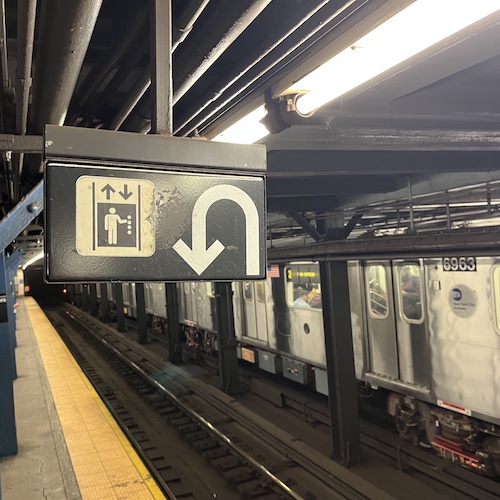 Interesting signage. About face for juggler, I think. Chambers Street Station, TriBeCa, Manhattan.