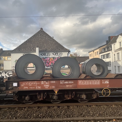 Steel rolls on steel wheels. Duisburg, Germany.