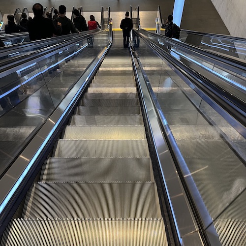 Escalator down, Friday rush. World Trade Center, Manhattan.