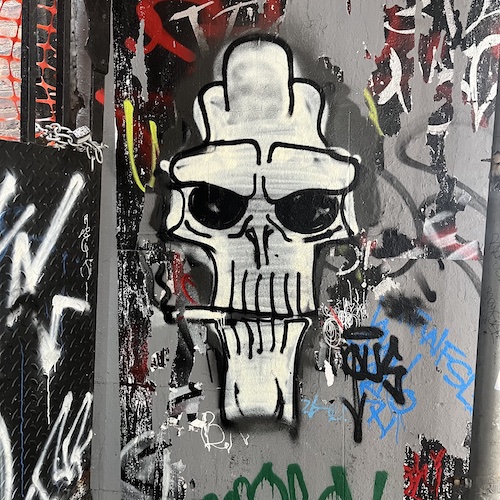 Smoking skull street art. 34 East 12th, Greenwich Village, Manhattan.
